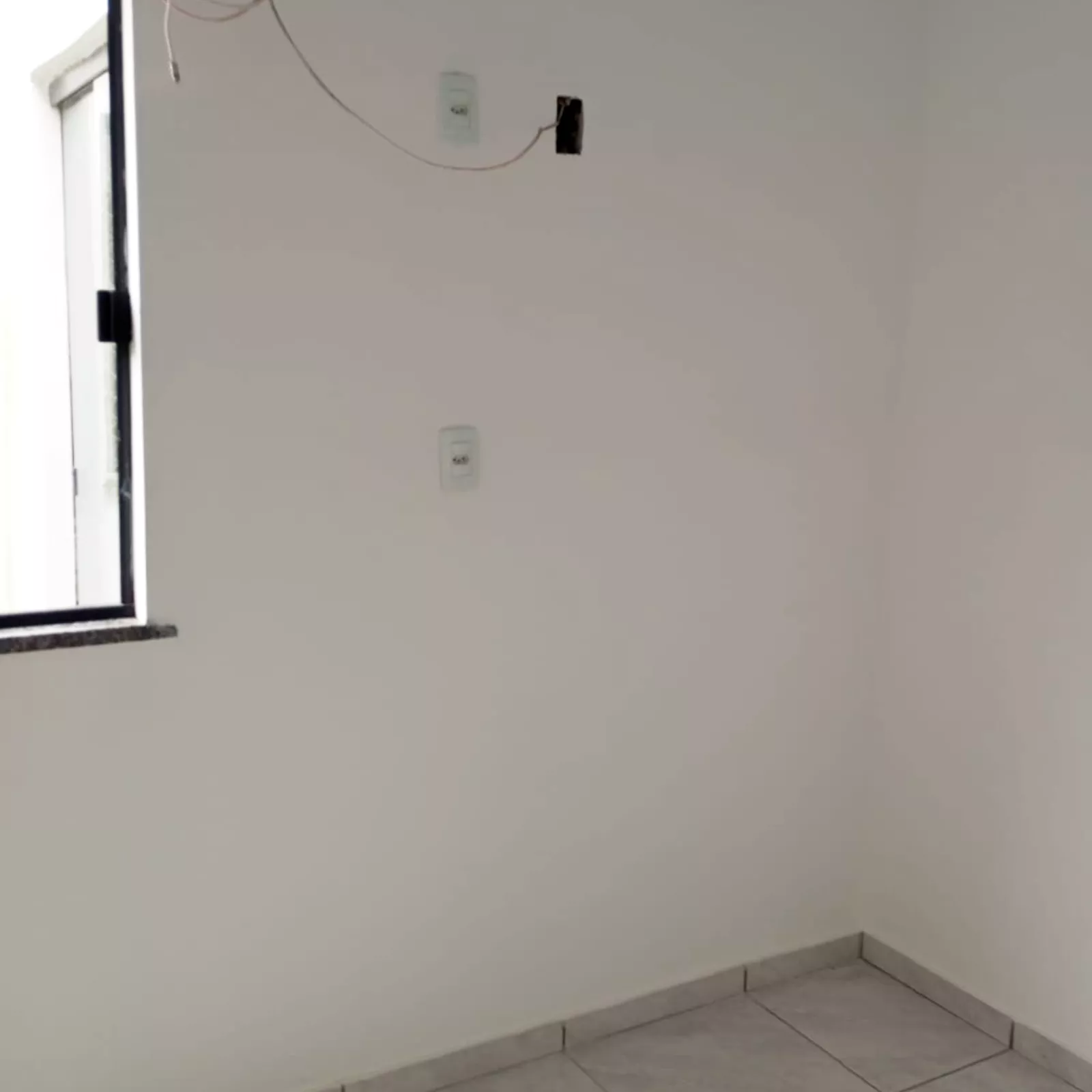 Sala de estar com sacada 